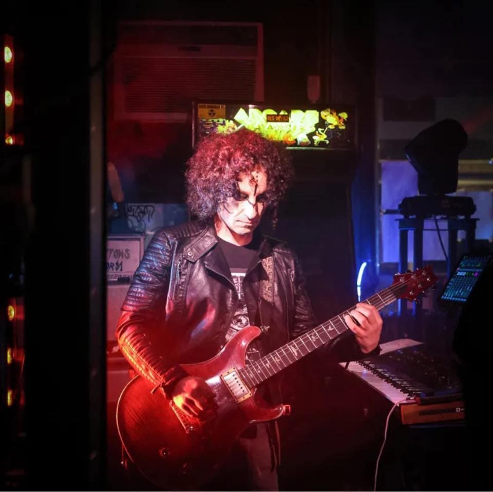 Scott playing guitar close-up